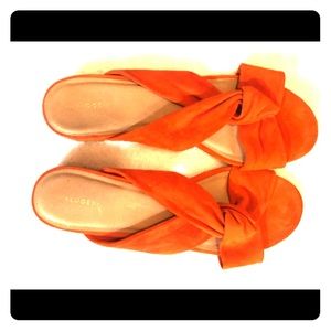 Orange suede flats